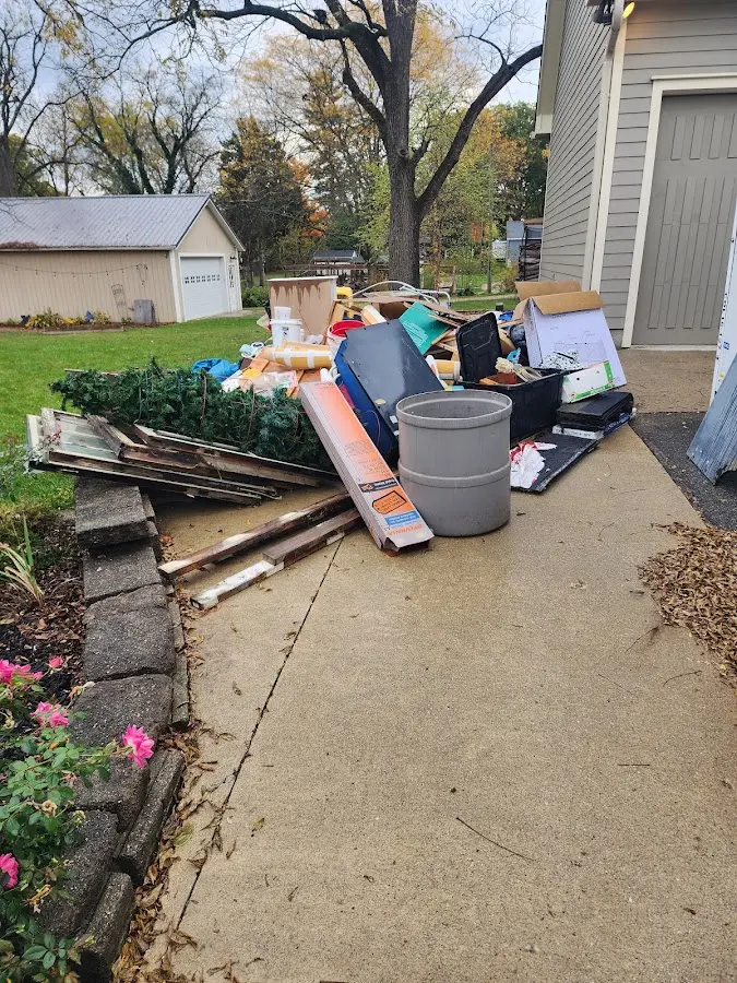 Dumpster being loaded with debris for Residential Dumpster Rental in Snowflake